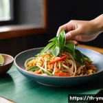 Home 21 식사 후 레시피 공유 방법 - A bright and inviting kitchen scene featuring a Thai home cook preparing a colorful dish using fresh...